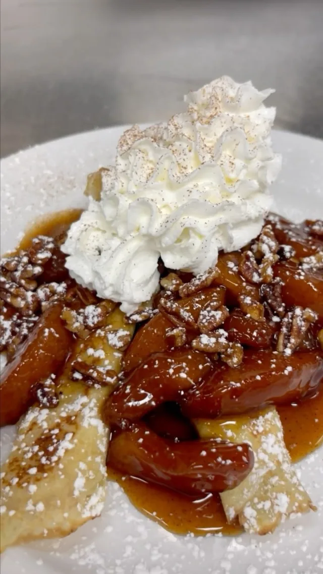 Our delicious Sweet Home Apple Bourbon Crepes 🍎🍯

Warm crepes stuffed with sweetened cream cheese and topped with our apple bourbon compote, candied pecans, whipped cream, powdered sugar, cinnamon and a honey drizzle. Try them today at a Wild Eggs near you!