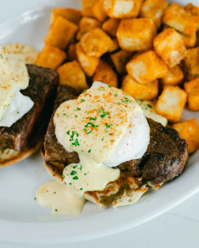 Start your day the hearty way! 🥩🍳 Dive into our Steak Bennie—seared sliced steak, perfectly poached eggs, and fresh hollandaise on a toasted English muffin, served with golden skillet potatoes. Visit us this weekend at Wild Eggs!